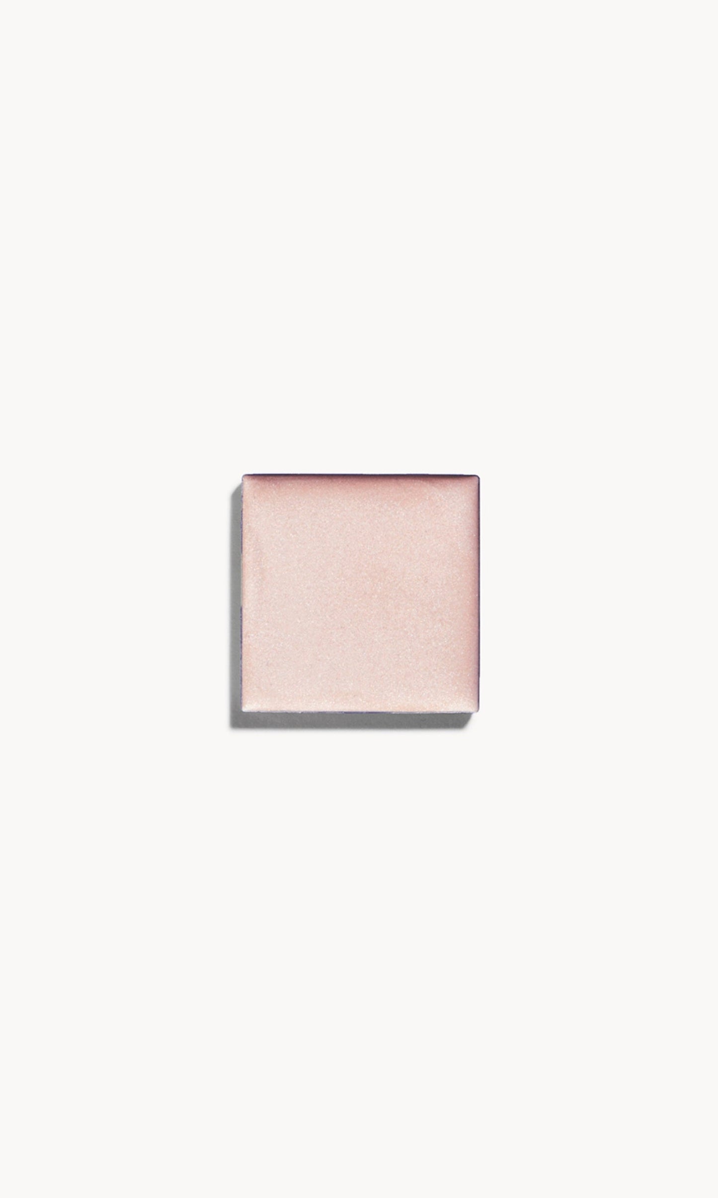 A square of cool silvery-pearl cream highlighter on a white background