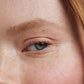 Close up of a person’s eye wearing light ivory eye shadow
