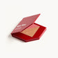 Red KW palette open to show the pink cream blush and sheer cream bronzer inside