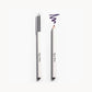 Two white pencils on a white background. Once pencil has a silver lid and the other shows the deep purple pencil with a purple line above it