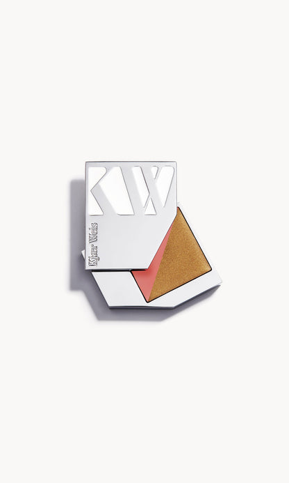 Silver metal KW palette open to show a rectangle palette split diagonally in half, with a golden cream bronzer on one side and a warm pink cream blush on the other
