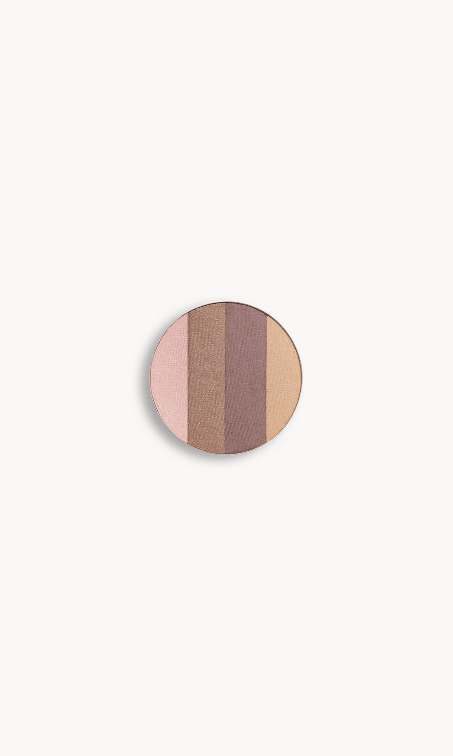 A circle of eye shadow split into four shades on a white background