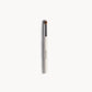 Eye makeup brush with white and silver handle, and short brown bristles on a white background