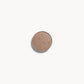 A circle of light mocha eye shadow on a white background