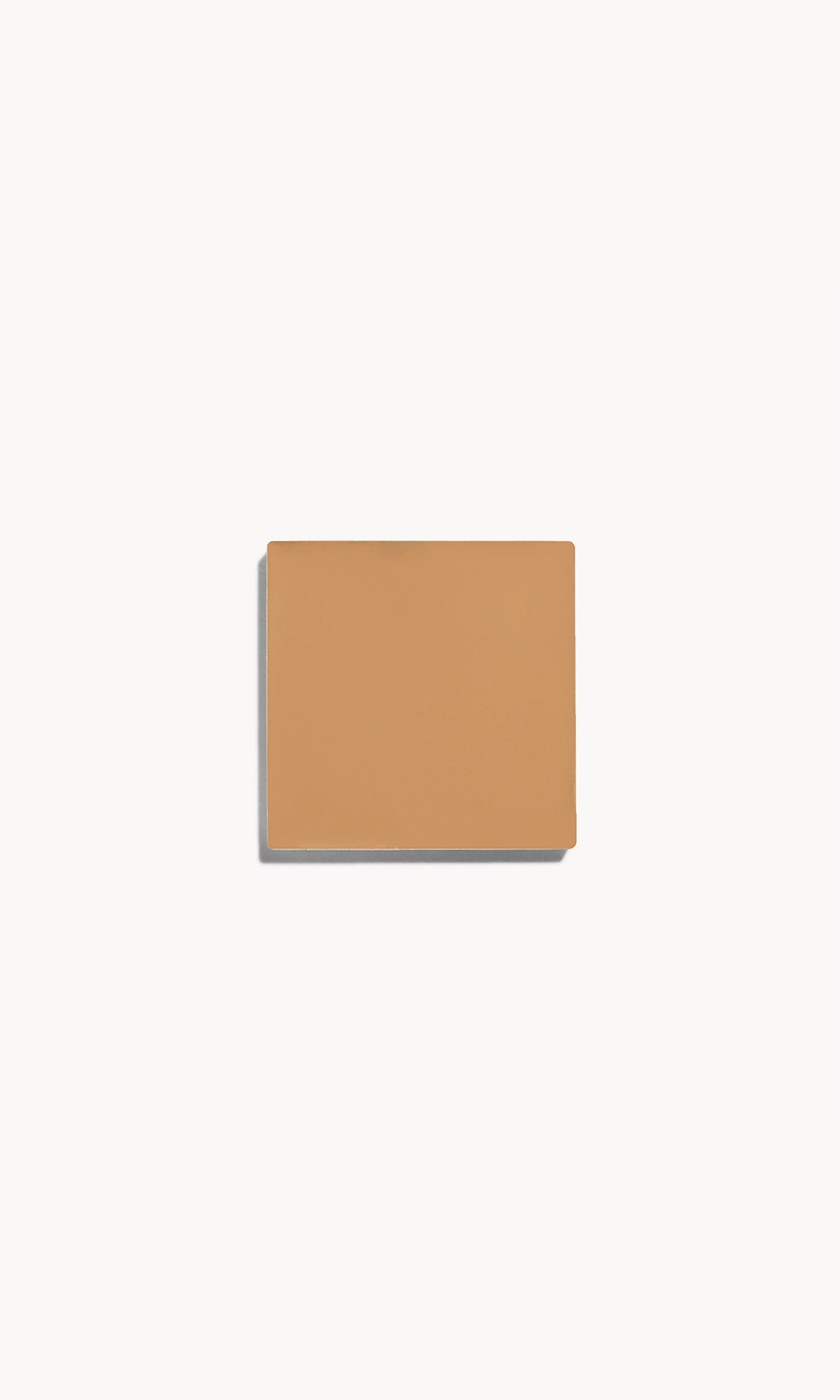 Square of medium cool-toned cream foundation on a white background