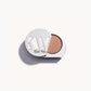 Solid metal KW palette with lid open to show iridescent champagne pink eye shadow inside