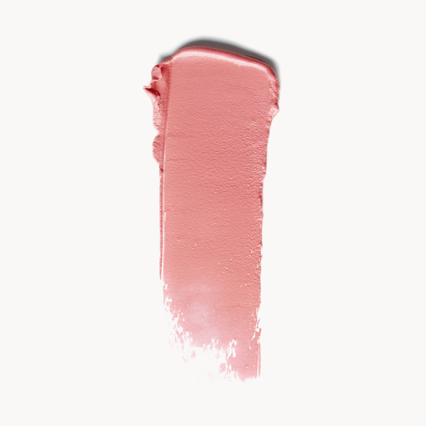 A wipe of cool pink cream blush on a white background